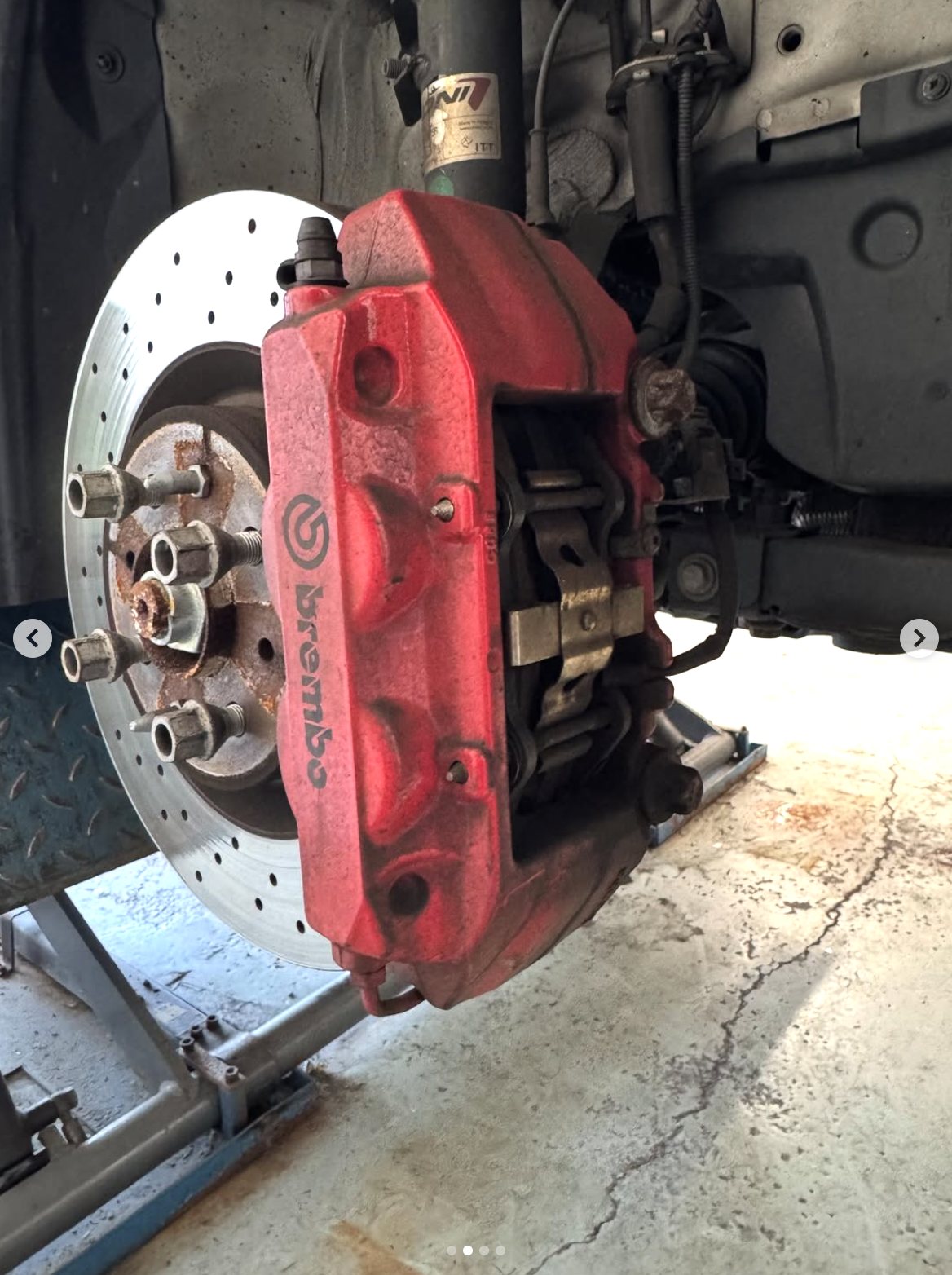 Brembo brake caliper before restoration — faded and dusty